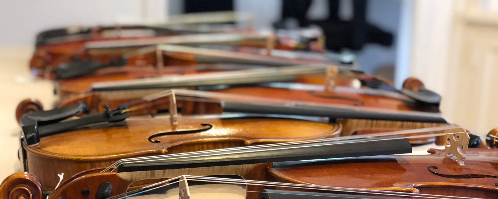 High-quality handcrafted violin with flamed maple back and spruce top, part of StringWorks professional violin collection for students to professionals